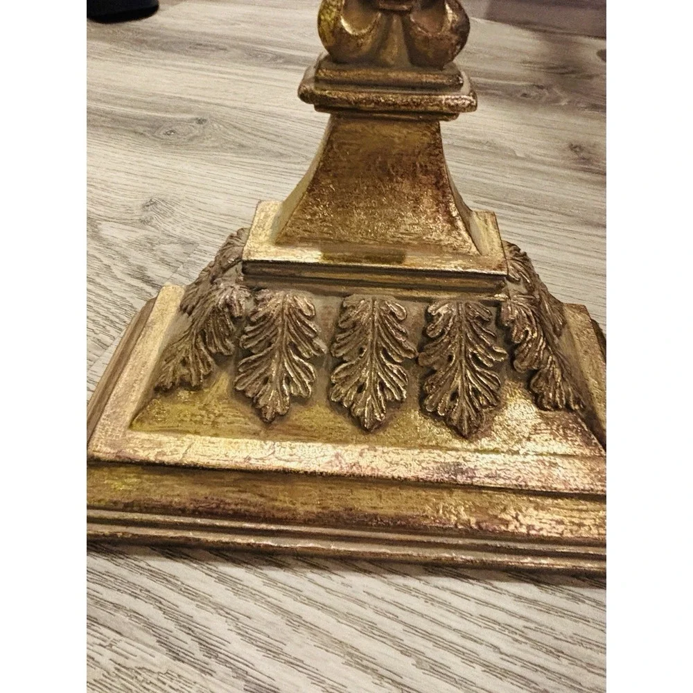 Vintage gold-toned decorative wall shelves with floral motifs.